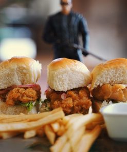 This chicken burger filled with buttermilk soaked fillets, fried until crispy golden brown, served with homemade pickled onion and chips is a must-try!