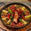 Order paella mixta with valenciana party tray and pay online via CarloPacific.com. Good for 10-12 pax.
