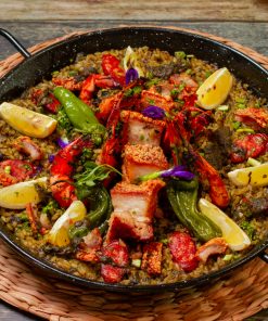 Order paella mixta with valenciana party tray and pay online via CarloPacific.com. Good for 10-12 pax.